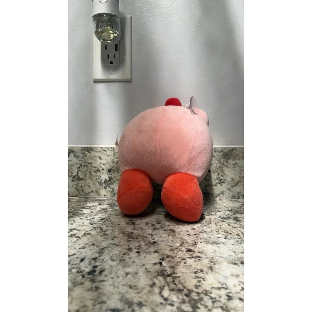 Kirby with strawberry plush